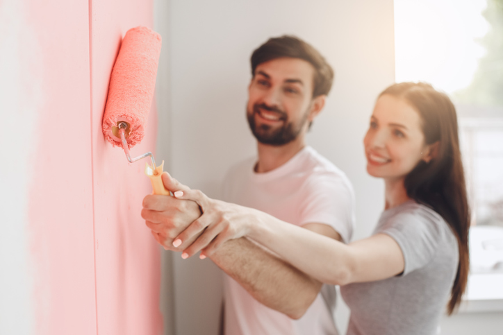 Young couple doing apartment repair together themselves