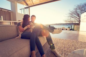 Couple on the sofa at sunrise.